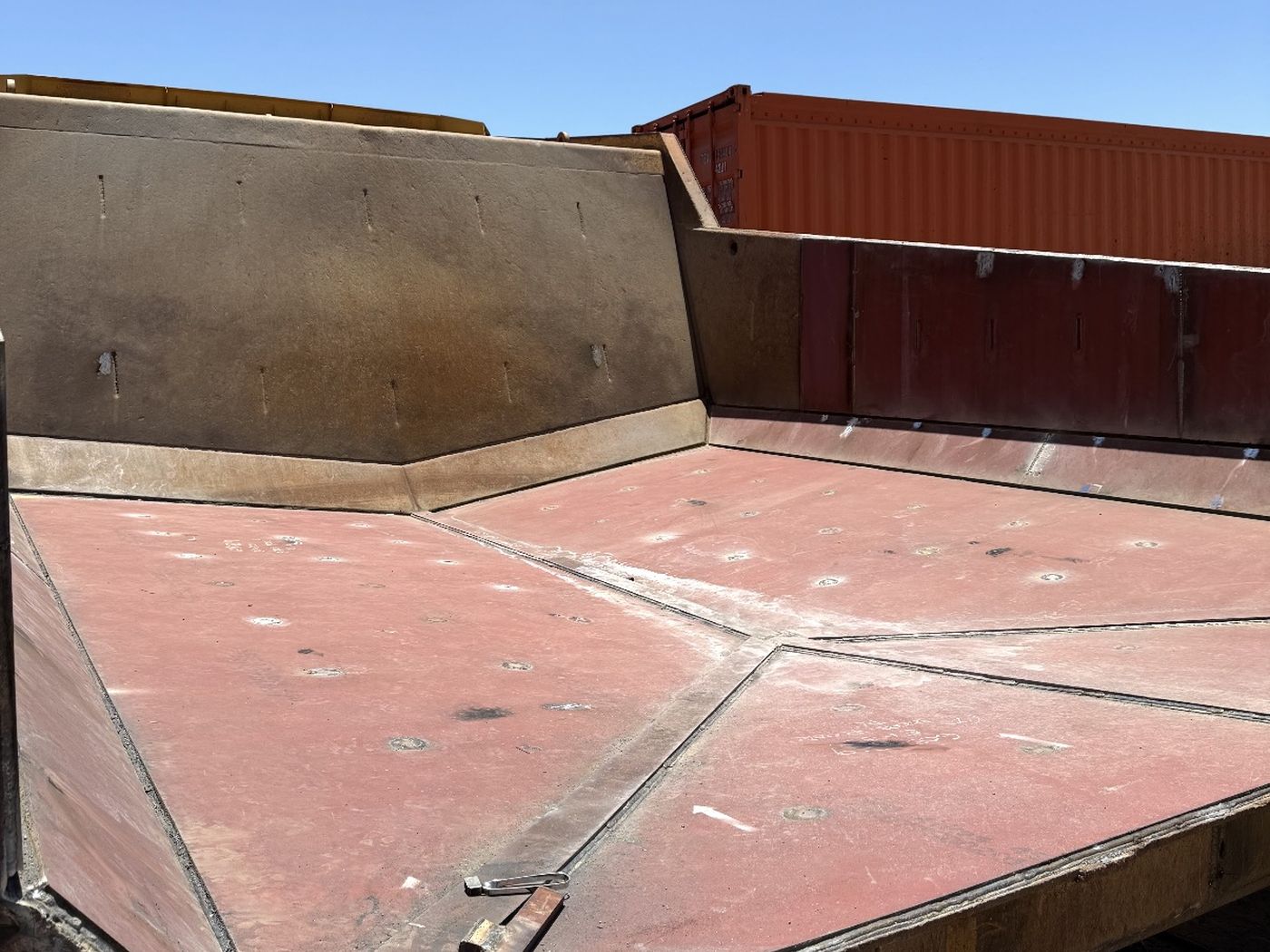 Dump truck tray floor relined with fresh wear plate, welded in